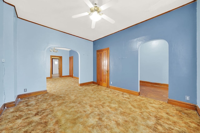 unfurnished room featuring ornamental molding, ceiling fan, and carpet floors