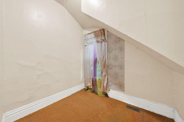 2333 W Huron St, Chicago, IL 60612 - bonus room featuring baseboards, carpet, lofted ceiling, and visible vents