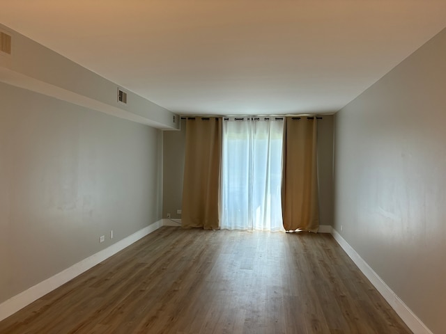 empty room featuring hardwood / wood-style flooring