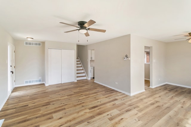 unfurnished room with ceiling fan and light hardwood / wood-style flooring