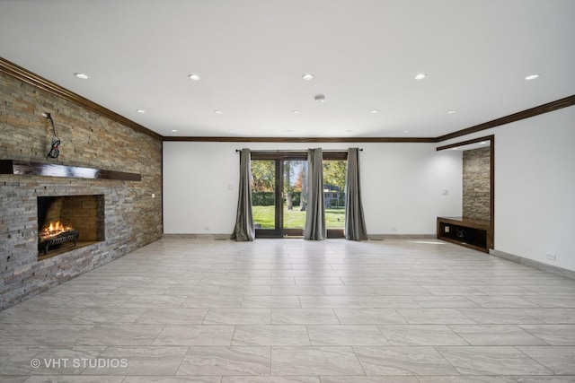 unfurnished living room featuring ornamental molding and a stone fireplace