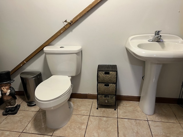 bathroom with tile patterned floors and toilet