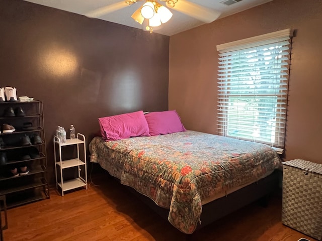 bedroom featuring ceiling fan and wood-type flooring