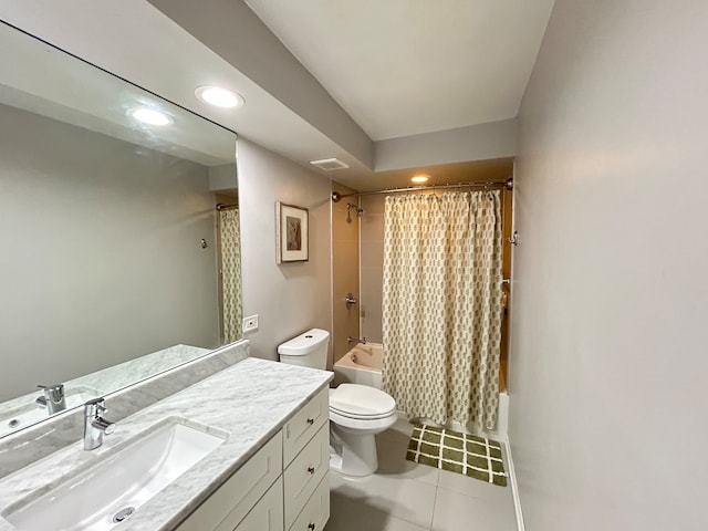 full bathroom with vanity, shower / bath combo with shower curtain, toilet, and tile patterned flooring