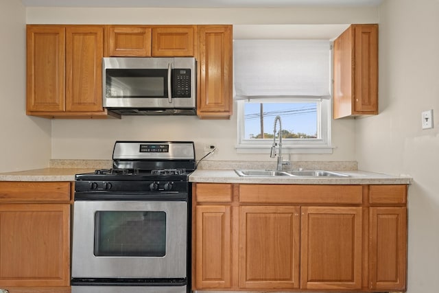 kitchen with appliances with stainless steel finishes and sink