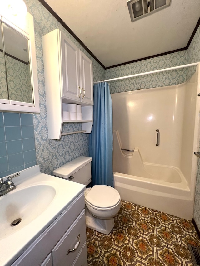 full bathroom featuring vanity, crown molding, toilet, and shower / tub combo with curtain