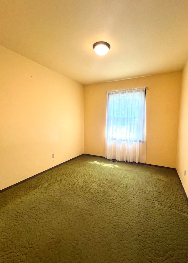 empty room with carpet flooring