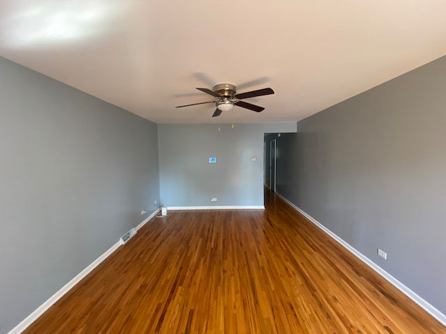 spare room featuring ceiling fan and wood-type flooring