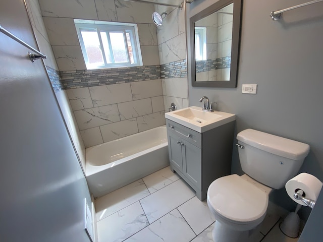 full bathroom featuring vanity, toilet, and tiled shower / bath