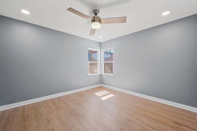 unfurnished room featuring light wood-type flooring and ceiling fan