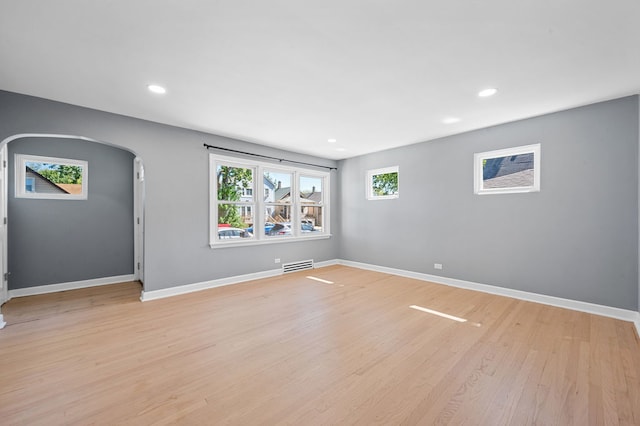 empty room featuring light hardwood / wood-style flooring and plenty of natural light