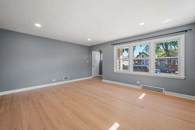 unfurnished room with light hardwood / wood-style floors