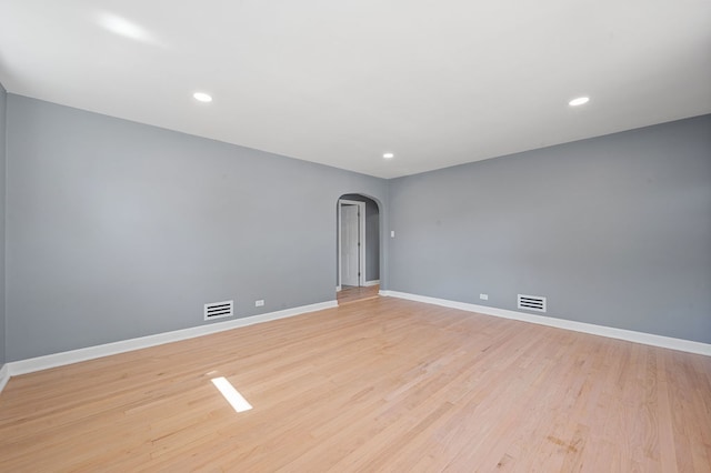 unfurnished room with light hardwood / wood-style floors