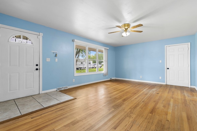 foyer featuring ceiling fan and light wood-type flooring