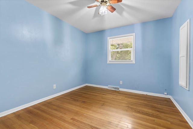 empty room featuring ceiling fan and light hardwood / wood-style floors