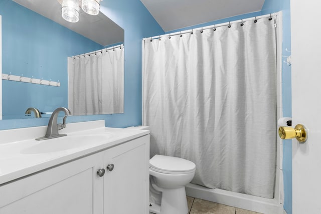 bathroom with vanity, toilet, a shower with shower curtain, and tile patterned floors