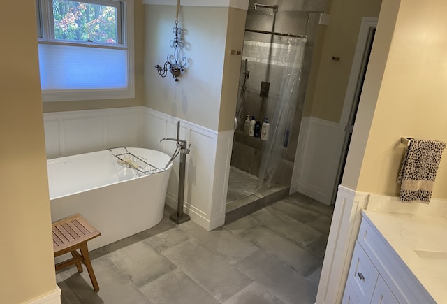 bathroom with vanity and separate shower and tub