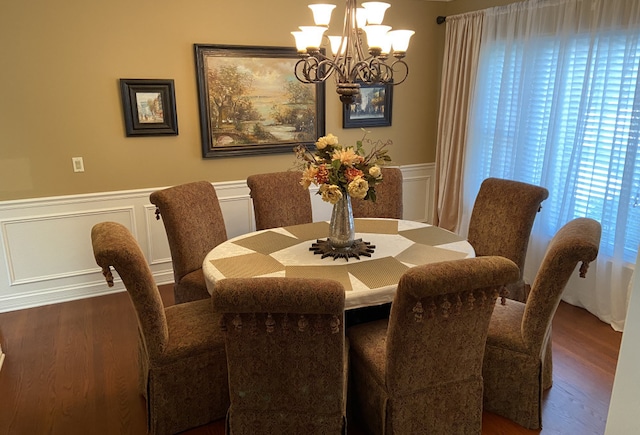 dining room featuring a wealth of natural light, a chandelier, and dark hardwood / wood-style floors