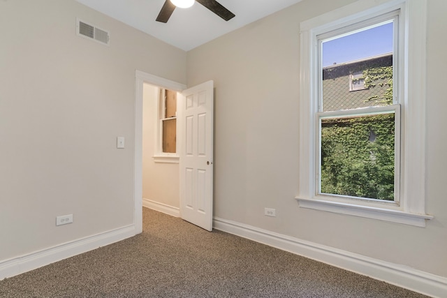 unfurnished bedroom featuring carpet and ceiling fan