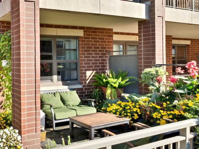 view of patio / terrace with a balcony and outdoor lounge area