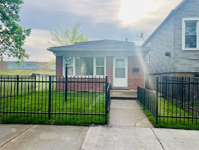 bungalow-style house featuring a front yard