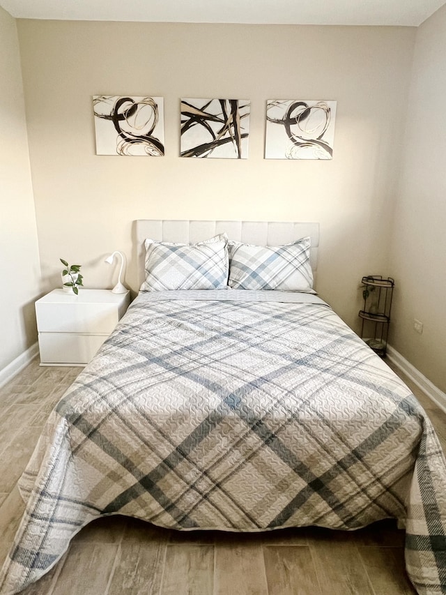 bedroom with wood-type flooring