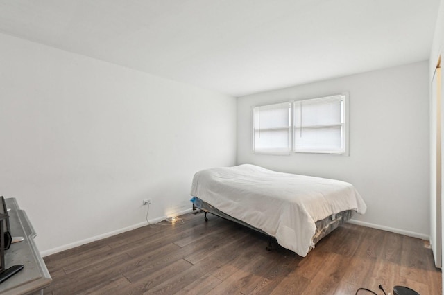 bedroom featuring dark wood-type flooring