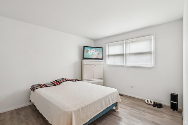 bedroom featuring wood-type flooring