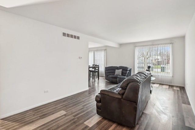 living room featuring dark hardwood / wood-style flooring