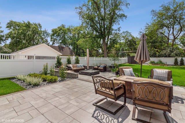 view of patio / terrace featuring an outdoor living space with a fire pit