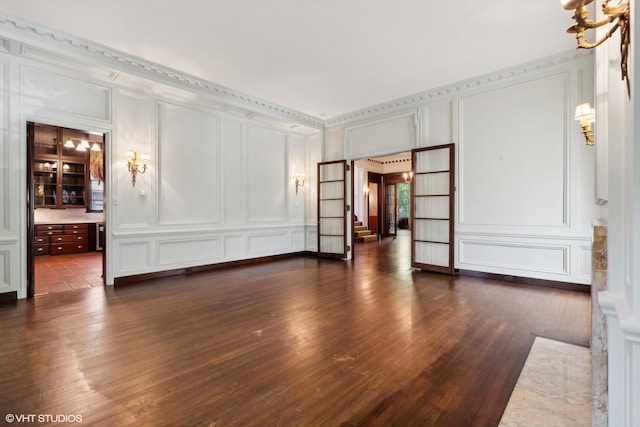 unfurnished living room featuring dark hardwood / wood-style floors