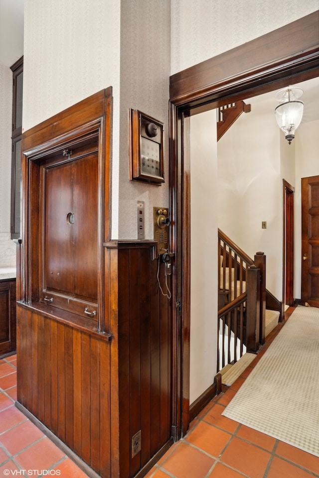 corridor featuring tile patterned flooring