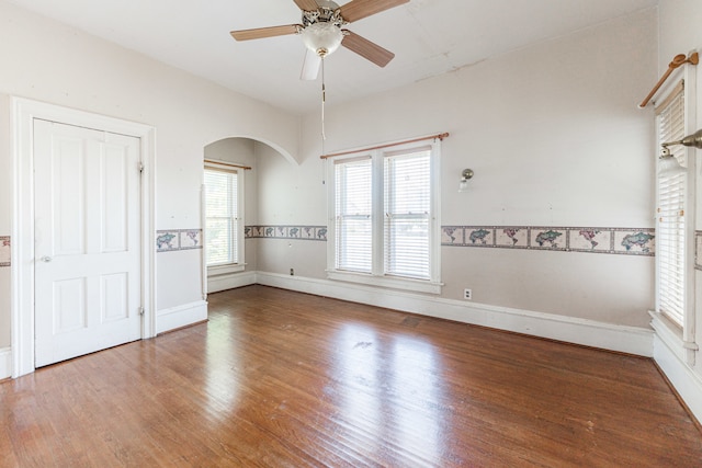 unfurnished room featuring ceiling fan and hardwood / wood-style flooring