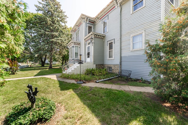 view of property exterior featuring a yard