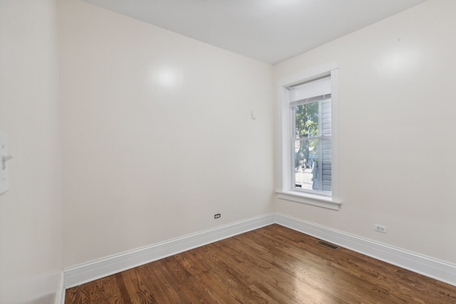 spare room with hardwood / wood-style floors