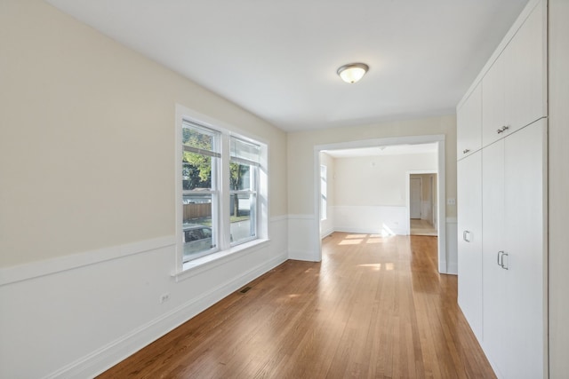 unfurnished room featuring light wood-type flooring