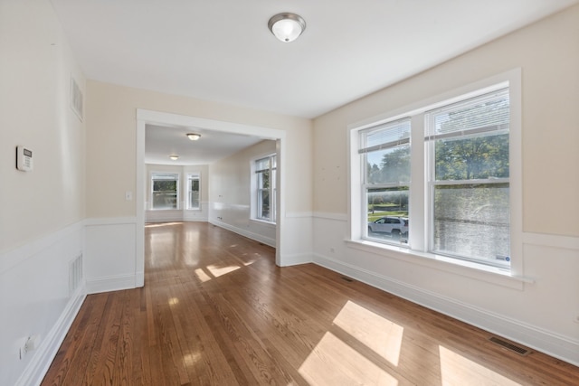 unfurnished living room with hardwood / wood-style floors