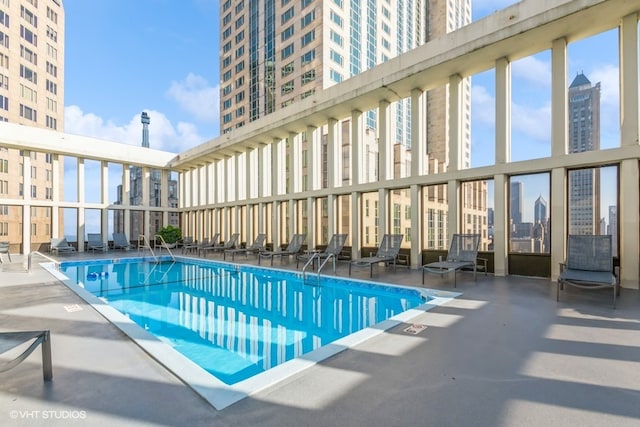 view of swimming pool featuring a patio