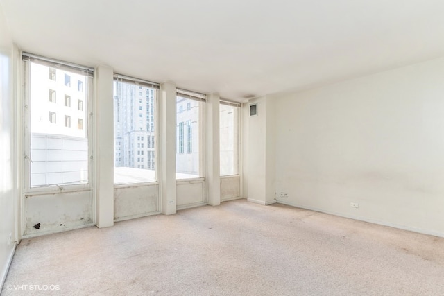 empty room with light colored carpet