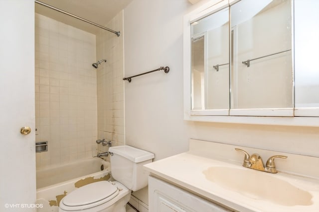 full bathroom featuring tiled shower / bath combo, vanity, and toilet