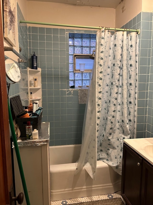 bathroom featuring shower / tub combo with curtain and vanity