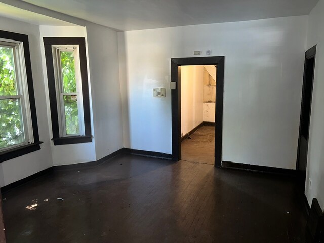 empty room featuring dark hardwood / wood-style floors