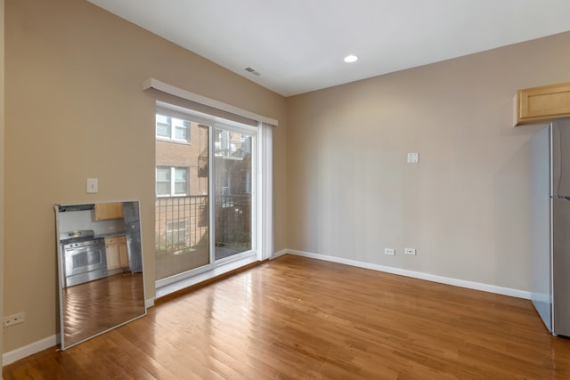 empty room featuring hardwood / wood-style floors