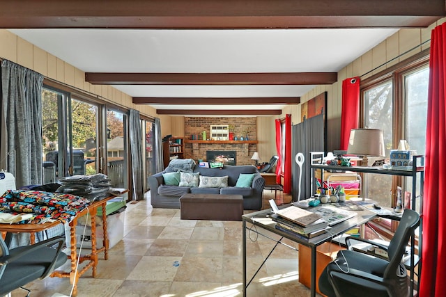 living room featuring a brick fireplace, wooden walls, and beam ceiling