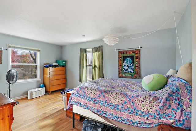 bedroom featuring wood-type flooring