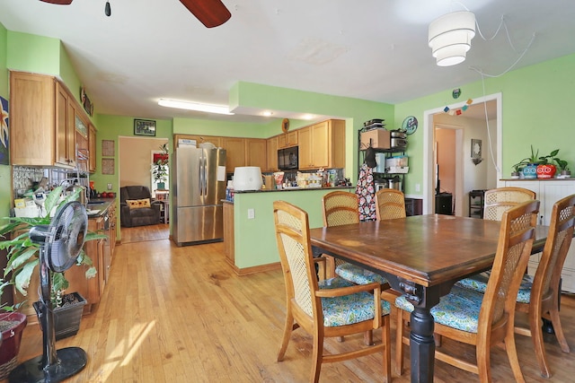 dining room featuring light hardwood / wood-style floors and ceiling fan