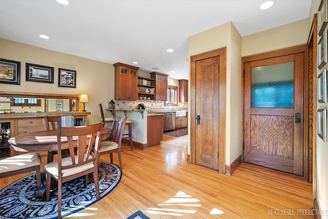 dining space with light wood-type flooring