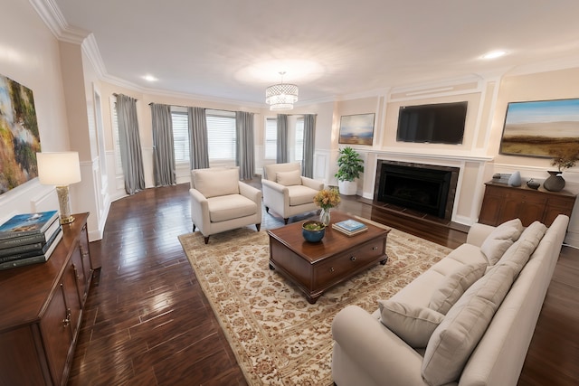 living room with ornamental molding, a chandelier, and dark wood-type flooring