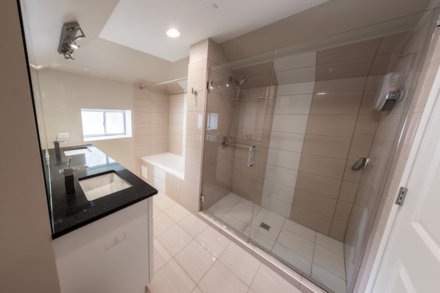 bathroom with vanity, a shower with shower door, and tile patterned flooring