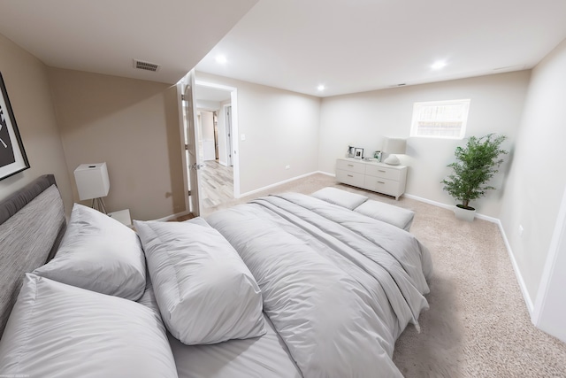 bedroom with light colored carpet